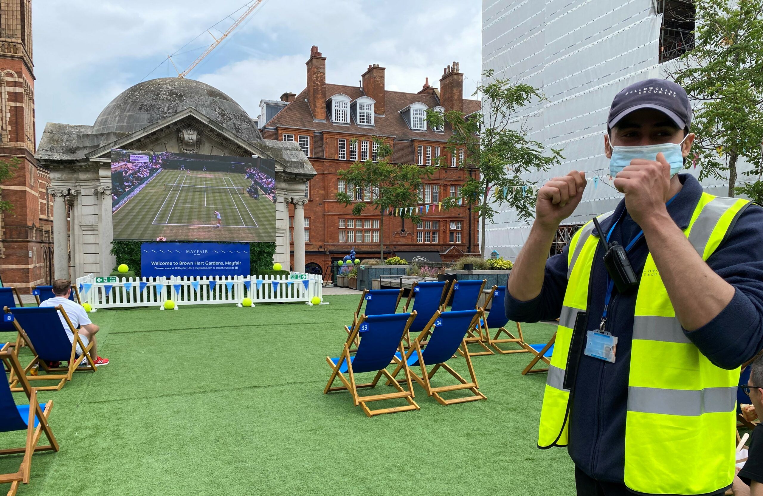 A Gallowglass Security officer on duty at the Wimbledon screening in Brown Hart Gardens in Mayfair.